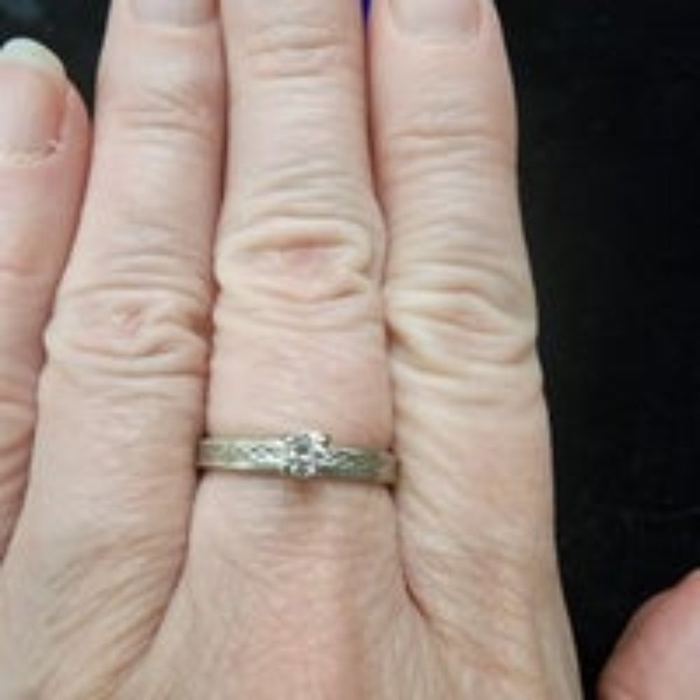 Style crest 14K white gold diamond solitaire ring.